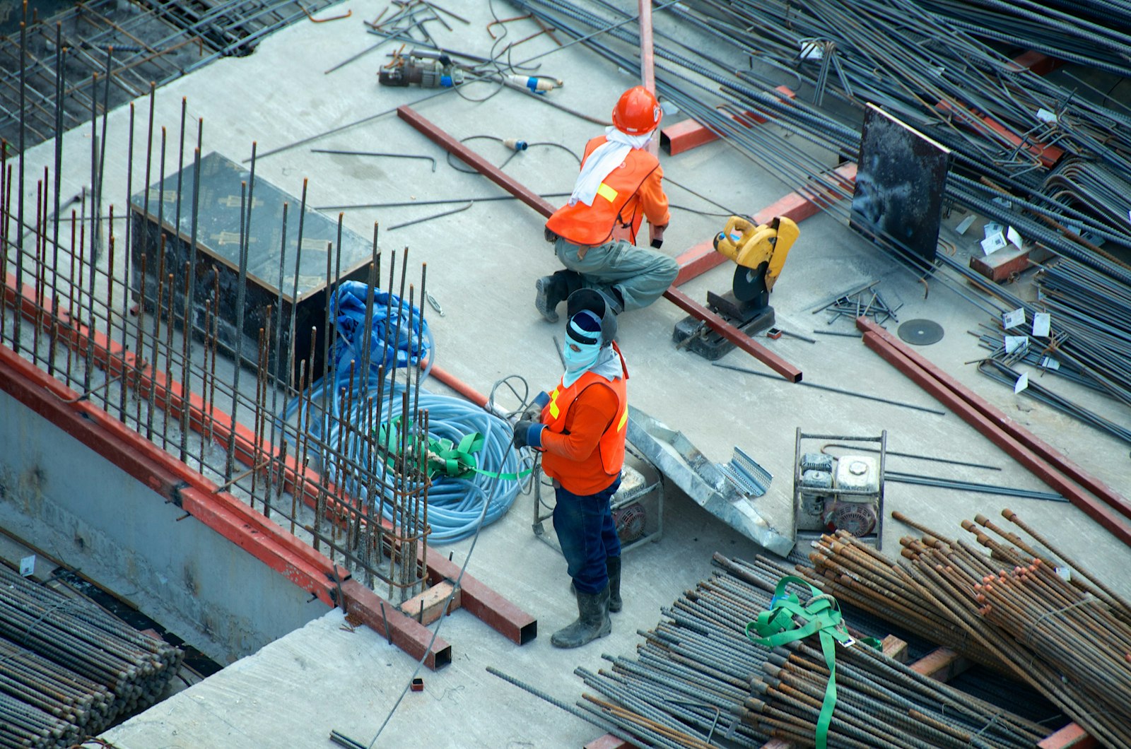 Construction workers reviewing plans on site